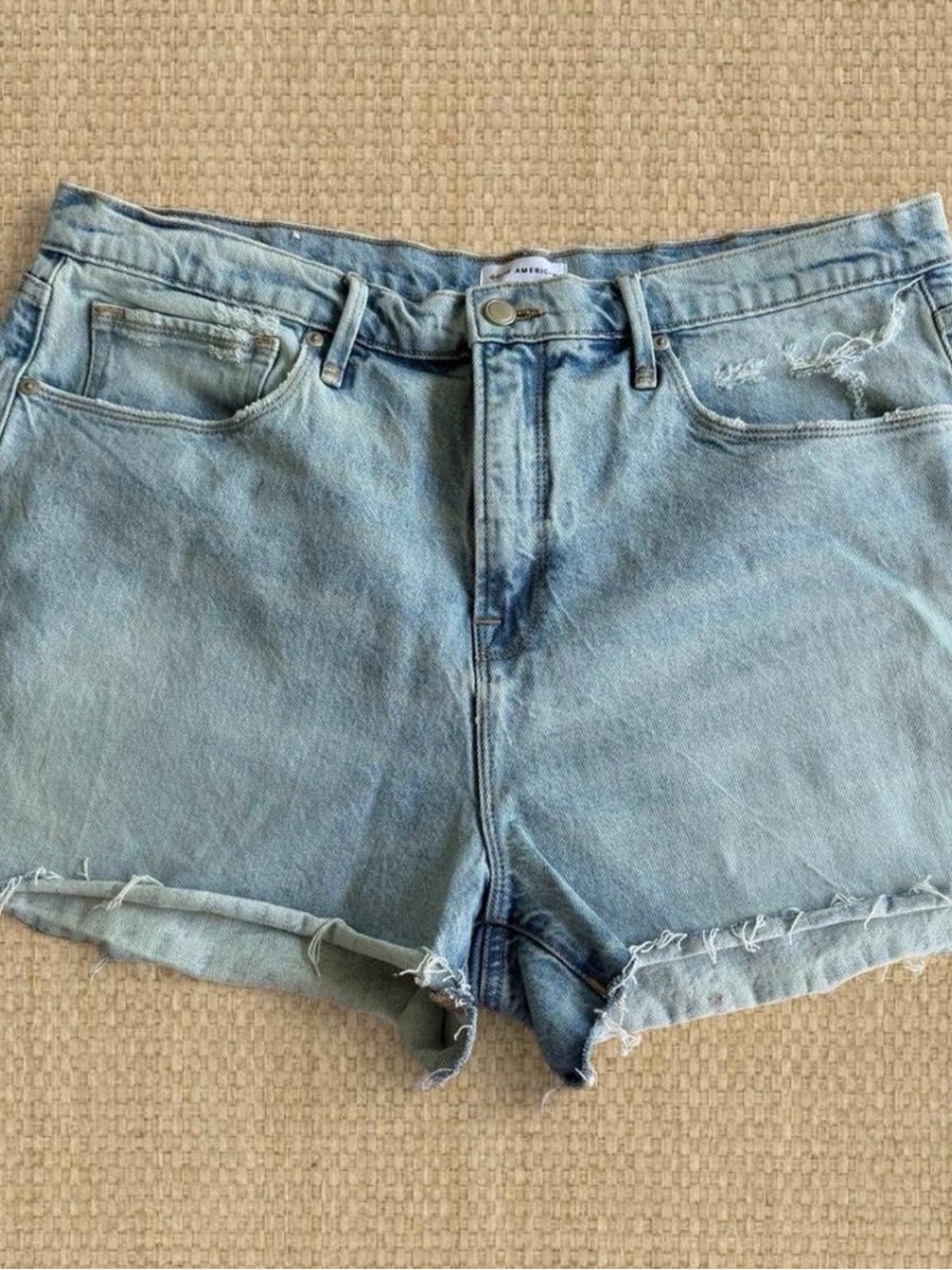 Good American Light Wash Distressed Denim Shorts
